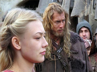 still_wolfhound Wolfhound (center) doesn't talk much, mostly stands around grimacing like that until it's time for swords. I'm not sure why the guy on the right is looking into the camera.
